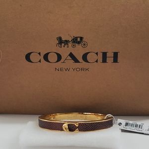 COACH SIGNATURE BRONZE PUSH HINGED BANGLE